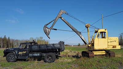 Excavator loading dump truck